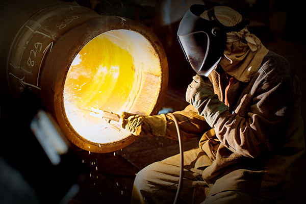 welder working on a pipe