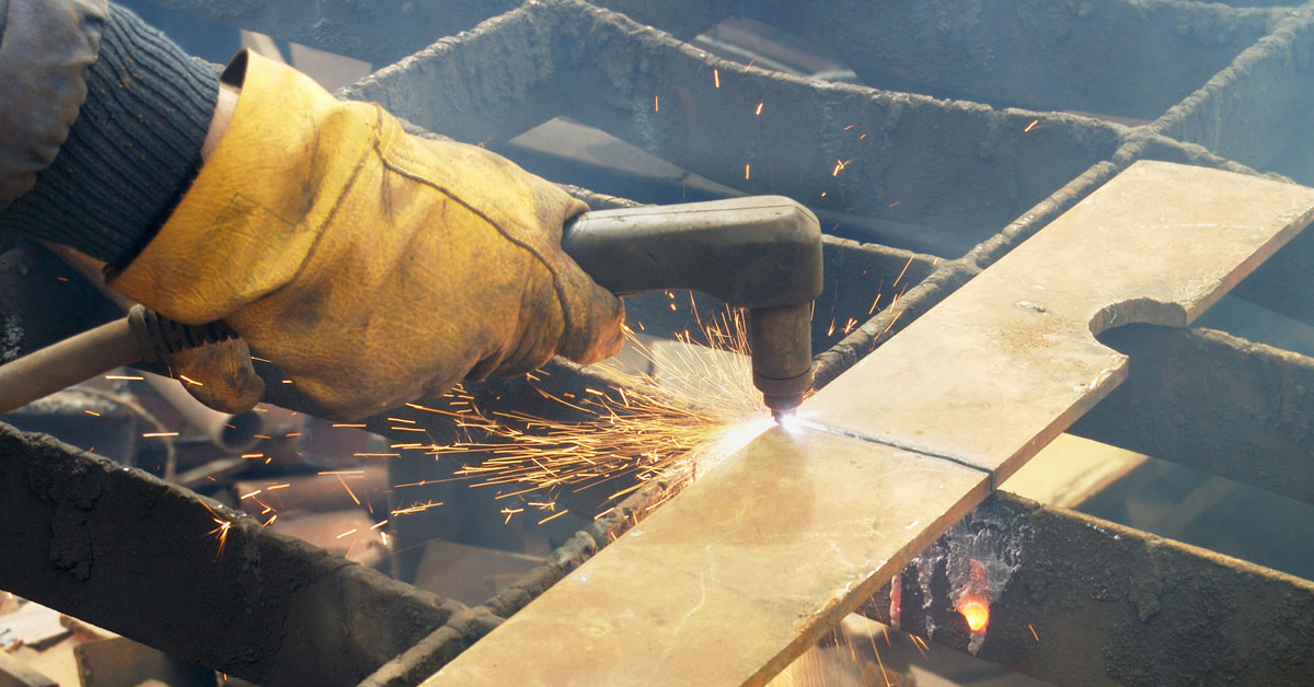 closeup of plasma cutter working on metal