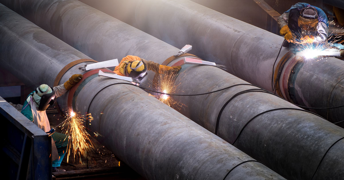 Worker using Oxyacetylene gas to weld in sheet metal factory